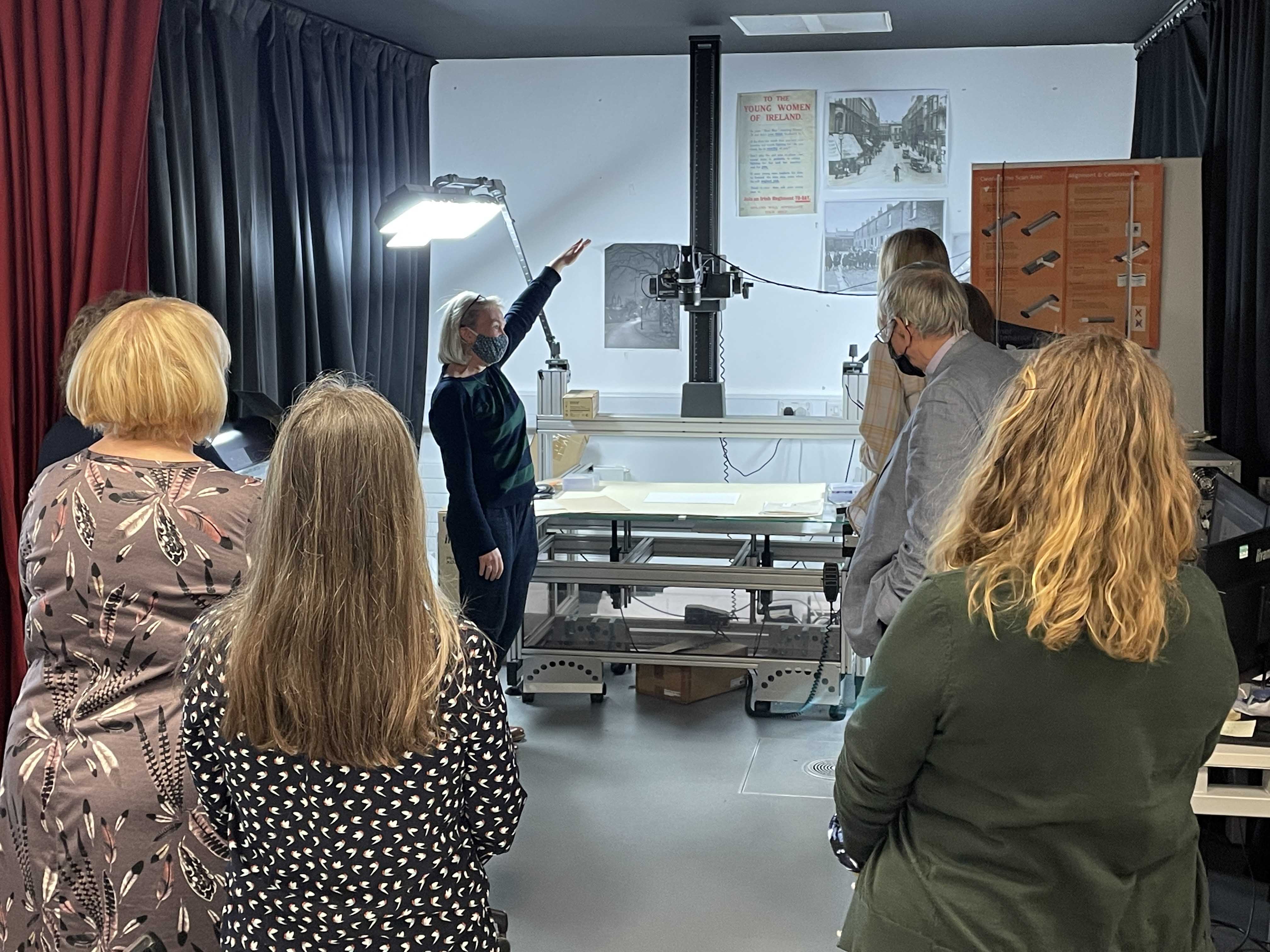 Joy Carey shows the group how PRONI digitises records. 